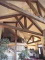 Hand-Hewn Timbers and Trusses / These hand-hewn timbers were stained by the contractor before installation Hand-Hewn Timbers and Trusses / These hand-hewn timbers were stained by the contractor before installation
